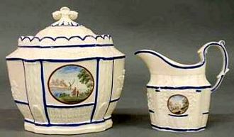 Hard paste sugar bowl and creamer with Chinese landscape decoration